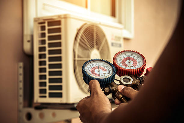 Professional Air Conditioning Service technician working in Green, OH